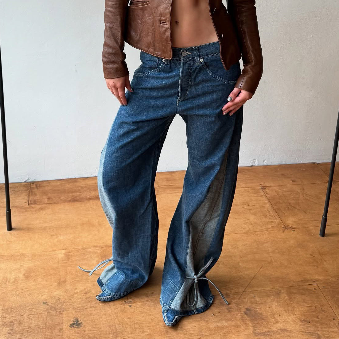 Women's design sense lace-up hem side color-blocked jeans, versatile street style American wide-leg straight-leg pants